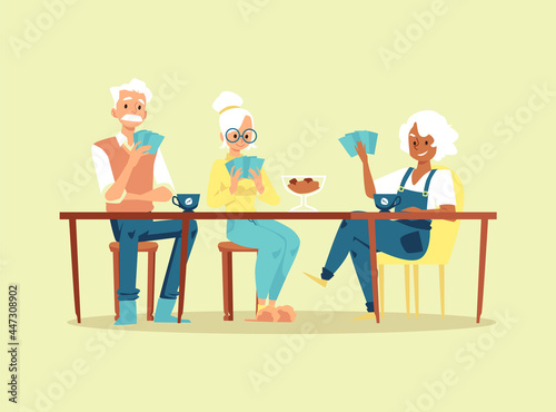 Old people play in card game sitting at table at home or retirement center.