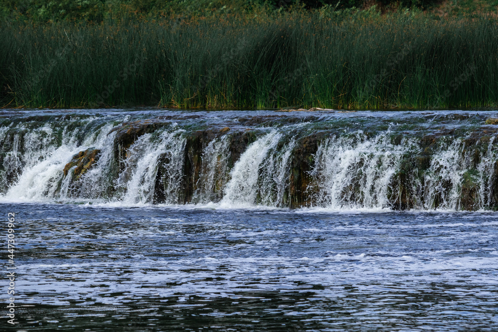 Fototapeta premium low and wide waterfall on the river