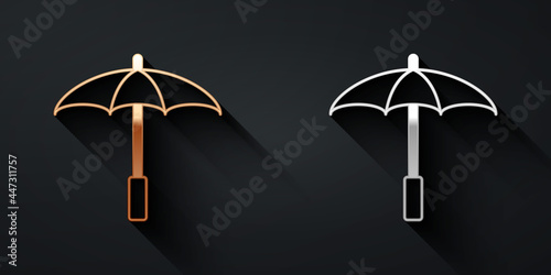 Gold and silver Sun protective umbrella for beach icon isolated on black background. Large parasol for outdoor space. Beach umbrella. Long shadow style. Vector