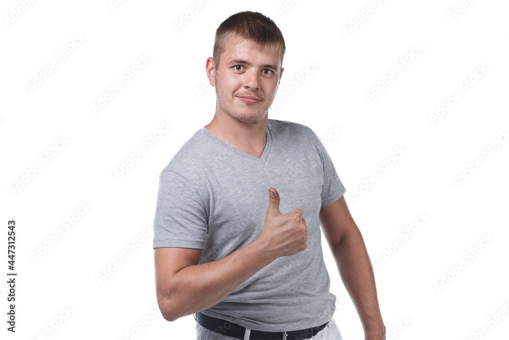 Photo of young man with bristle showing thumb Photo of young man with bristle showing thumb