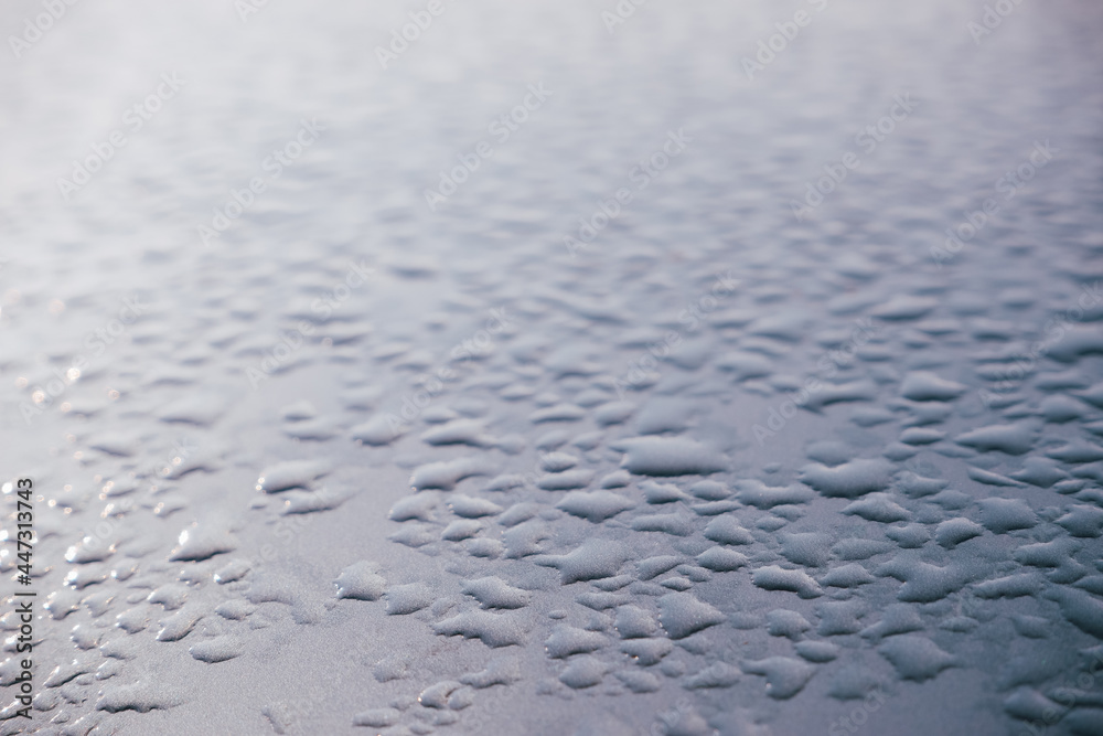 Abstract background ornament with water drops. Raindrops on a polished surface. Abstract background ornament with water drops. Raindrops on a polished surface.