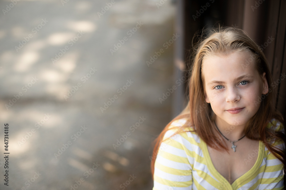 Portrait of little girl face with blue eyes looking at camera Portrait of little girl face with blue eyes looking at camera