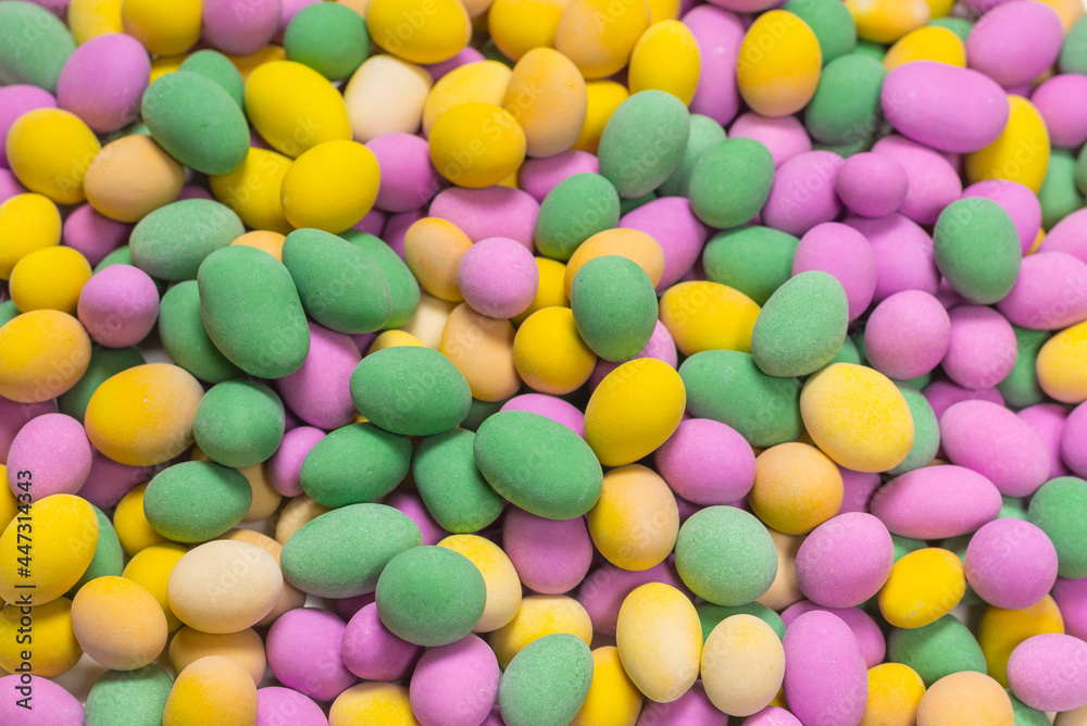 Group of colorful peanuts in glaze.
