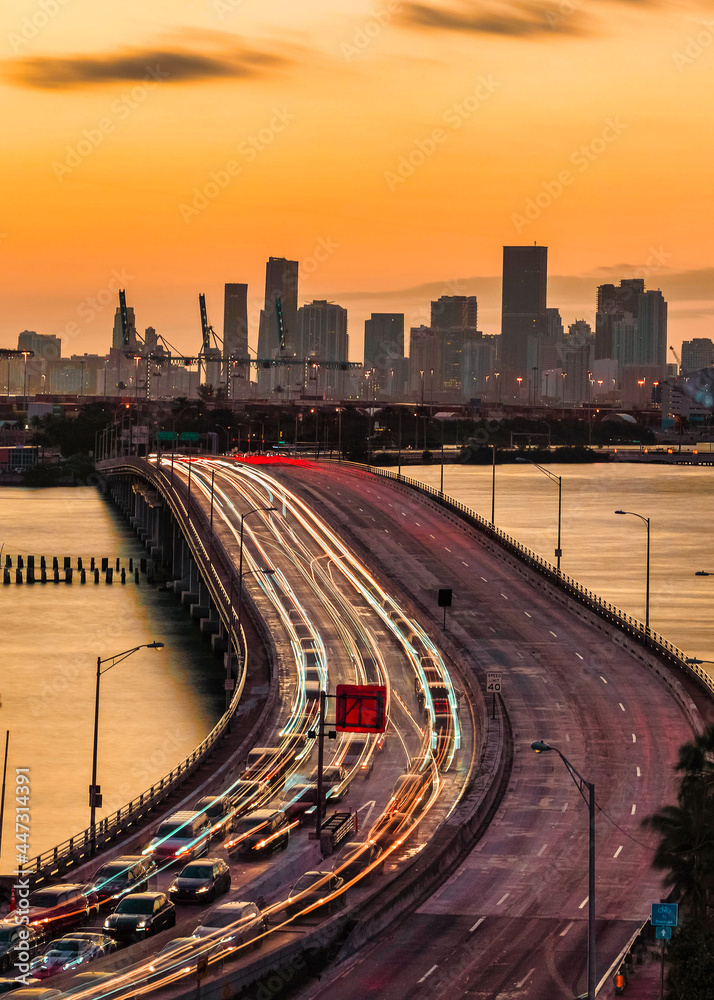 city skyline at sunset beautiful view traffic Miami Florida usa buildings cars road panorama sea bridge sky color orange travel city skyline at sunset beautiful view traffic Miami Florida usa buildings cars road panorama sea bridge sky color orange travel