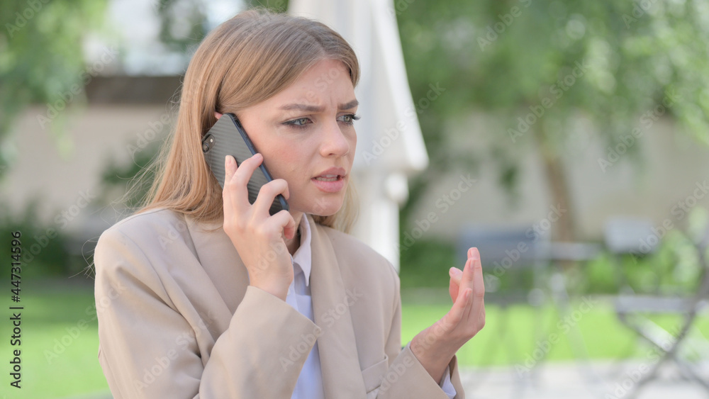 Outdoor Angry Businesswoman Talking on Phone