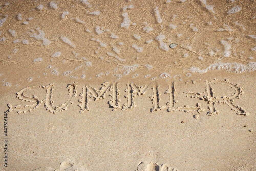 Fototapeta premium Inscription summer and incoming sea wave on sand at beach. Travel and vacation time