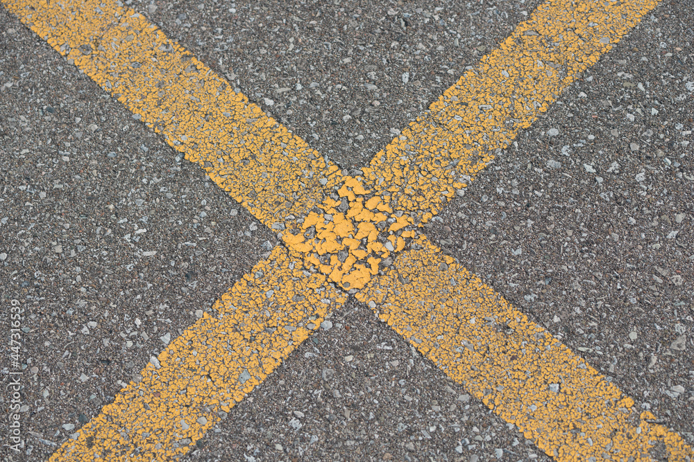 lines on asphalt - parking spot lines cracked yellow paint
