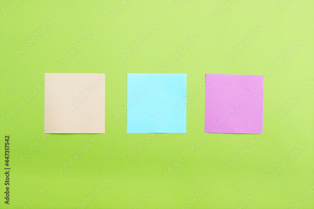 The empty space on multi-colored office stickers.