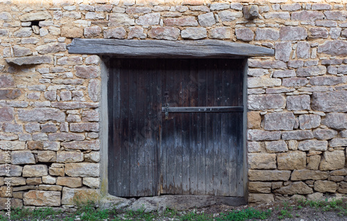 old wooden door in a stone wall