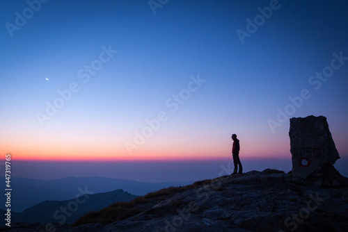 Man Observing Dawn at Korab Peak, Northern Macedonia © Martin