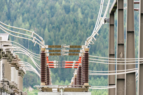 The electric power station transformer, high-voltage equipment object. Distribution electric substation with power lines. Busbar, autotransformer, supports, switchgear.