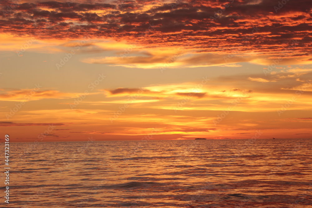 Obraz premium Sunset. Dramatic sunset sky with clouds. Dramatic sunset over the sea