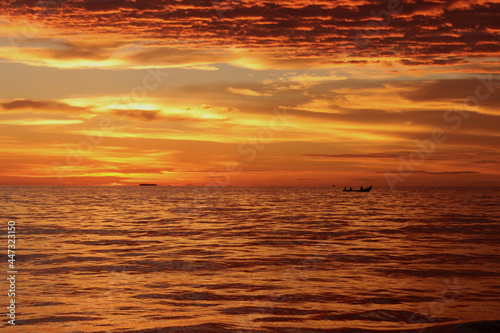 Sunset. Dramatic sunset sky with clouds. Dramatic sunset over the sea