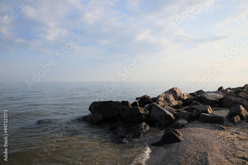 Beautiful view sandy sea beach with rocks