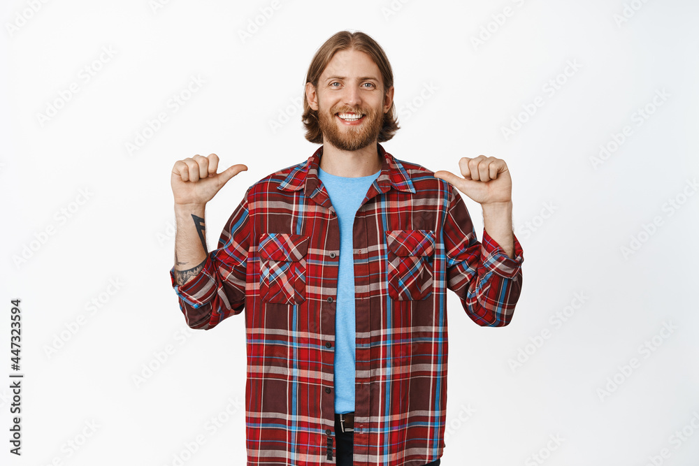 Image of handsome happy blond guy with beard, smiling and pointing at himself, self-promoting, bragging, being proud of personal achievement, white background