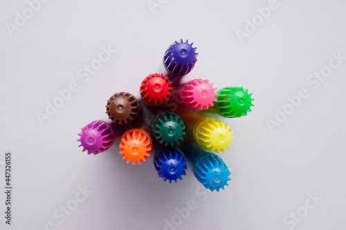 Set of colorful markers seen from above. White background. Copy space