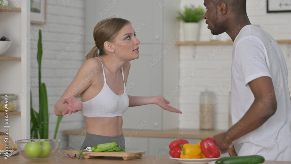 Fighting Woman Arguing with African Man in Kitchen Fighting Woman Arguing with African Man in Kitchen