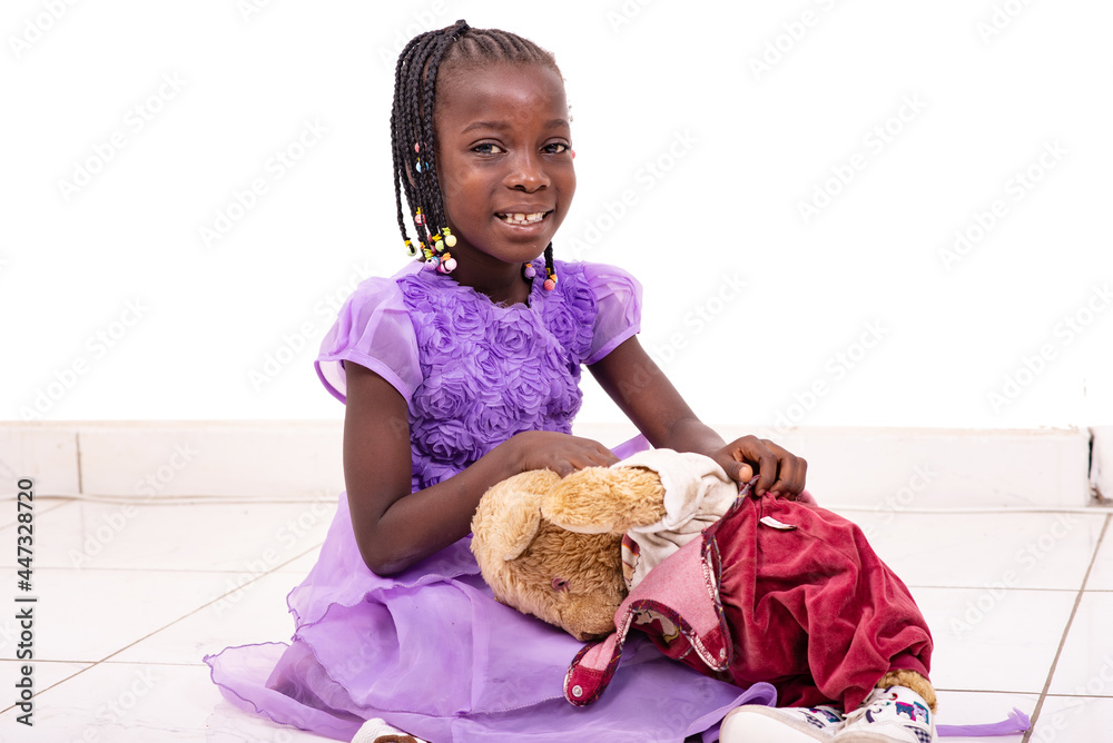 cute little girl playing with her teddy bear smiling. cute little girl playing with her teddy bear smiling.