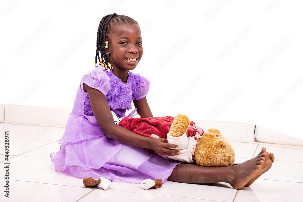 cute little girl playing with her teddy bear smiling. cute little girl playing with her teddy bear smiling.