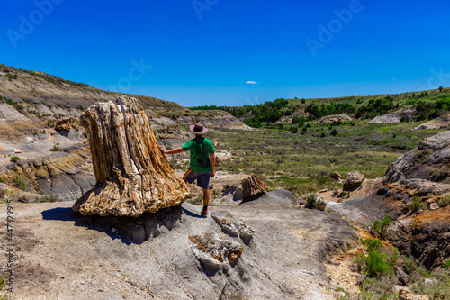 Man enjoying the view along The Petrified Forest Loop Trail inside Theodore Roosevelt National Park, North Dakota