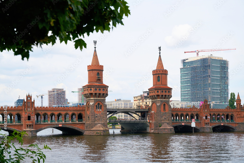 The Oberbaum Bridge over the river Spree in Berlin connects the districts Kreuzberg and Friedrichshain