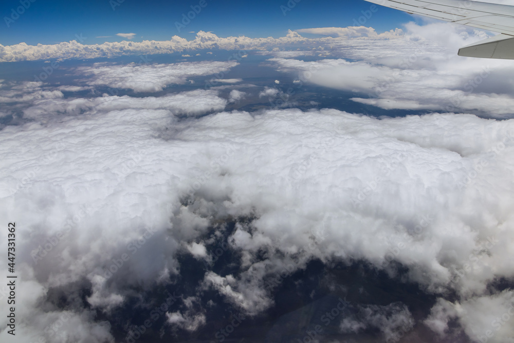 Wing aircraft in altitude during flying above the clouds