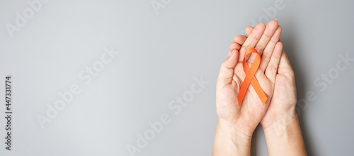 Leukemia, Kidney cancer day, world Multiple Sclerosis, CRPS, Self Injury Awareness month, Orange Ribbon for supporting people living and illness. Healthcare and World cancer day concept photo
