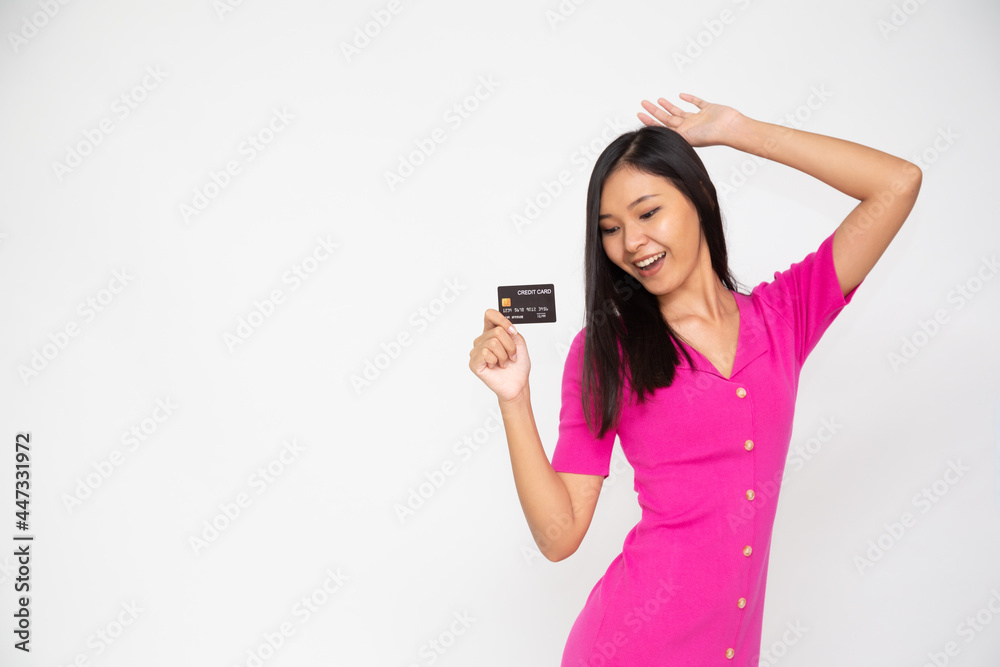 Young Asian woman showing credit card for making payment or paying online business isolated on white background Young Asian woman showing credit card for making payment or paying online business isolated on white background
