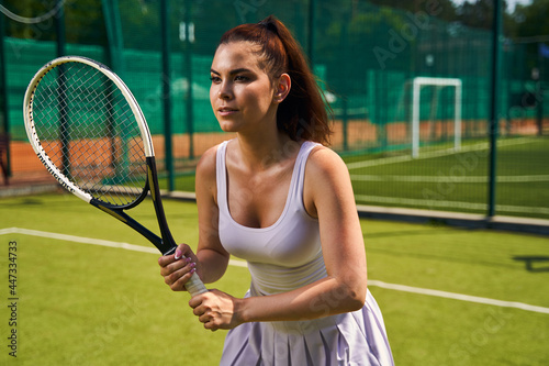 Professional female athlete getting ready for a tennis match