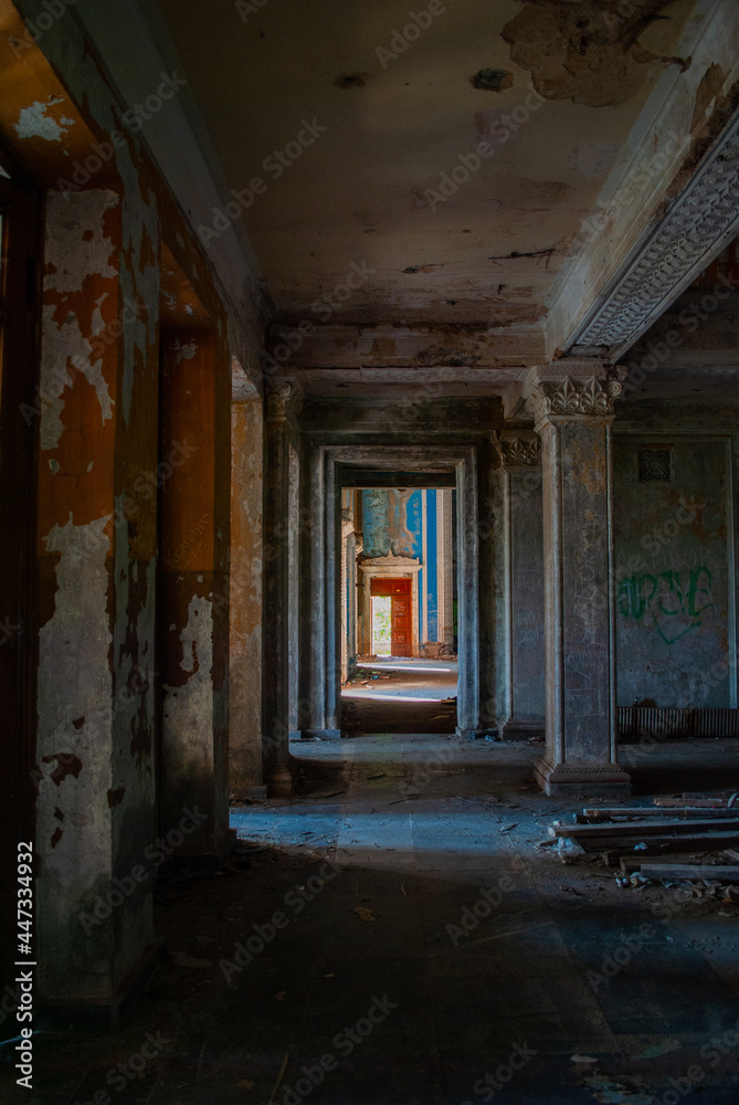 Fototapeta premium The inner hall of an abandoned building on a sunny summer day, Gagra, Abkhazia