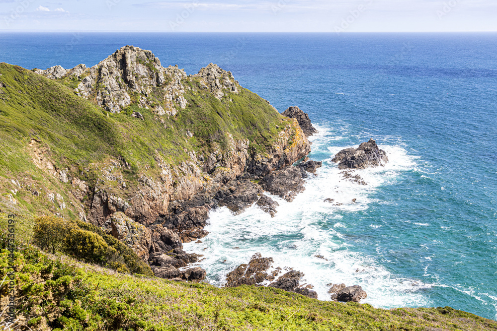 The cliffs at Pointe de la Moye, Le Gouffre, Les Villets on the beautiful, rugged south coast of Guernsey, Channel Islands UK The cliffs at Pointe de la Moye, Le Gouffre, Les Villets on the beautiful, rugged south coast of Guernsey, Channel Islands UK
