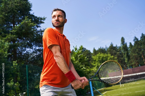 Male tennis player getting ready to receive a serve © Viacheslav Yakobchuk
