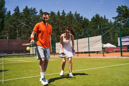 Two focused sportspeople perfecting their tennis skills