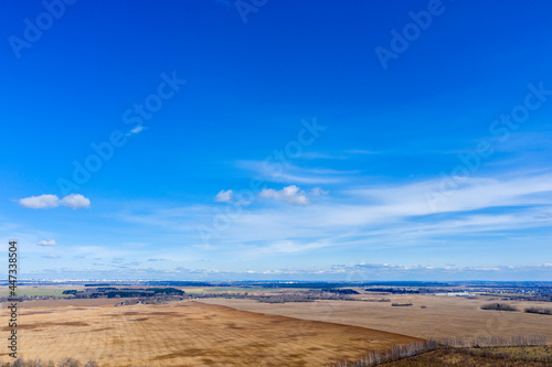 Aerial view of agricultural landscape with fields in spring season.