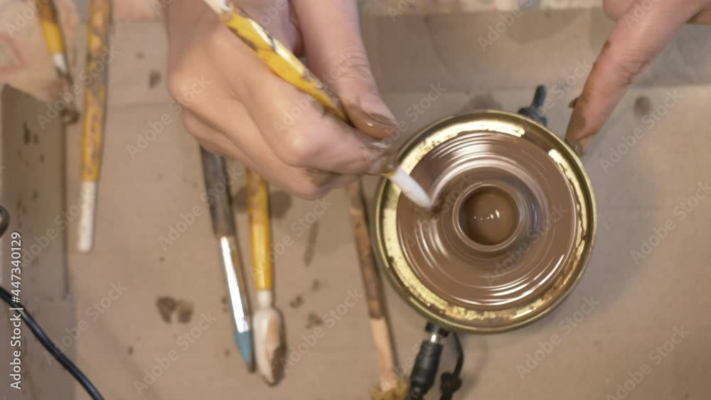 Handcrafted Ceramics Making On Pottery Wheel. Female artist using a ...