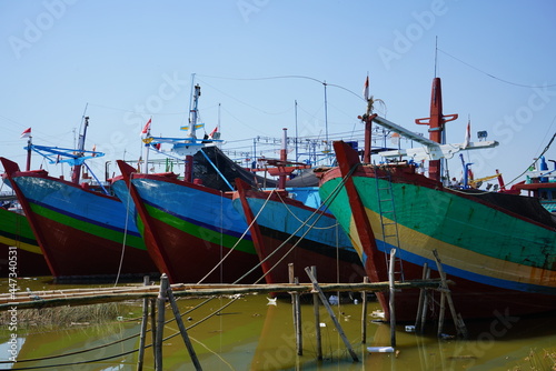 A wooden fishing boat is parked at the mouth of the Juwana River  Pati  Central Java  Indonesia.