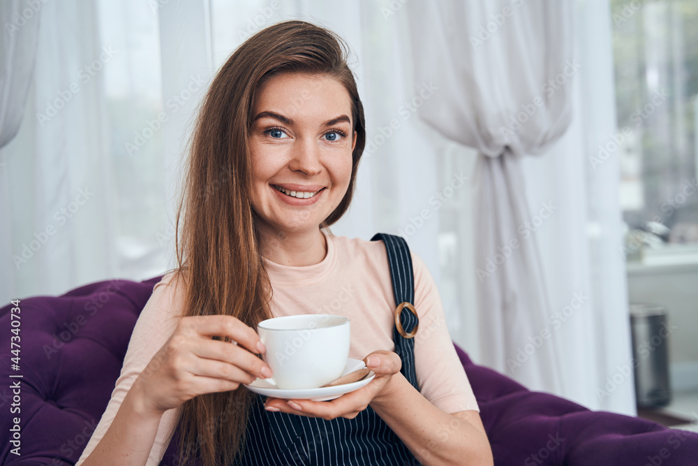 Portrait of happy woman posing on camera Portrait of happy woman posing on camera