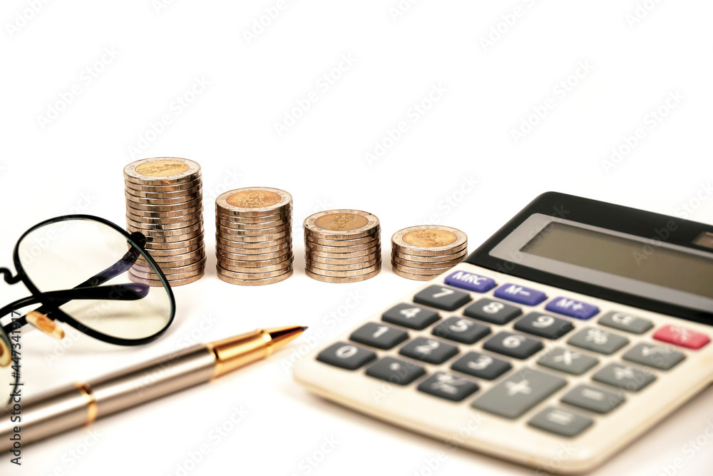 busines, finance, money and bookkeeping concept - calculator, pen, eyeglasses and thai coins on white background. busines, finance, money and bookkeeping concept - calculator, pen, eyeglasses and thai coins on white background.