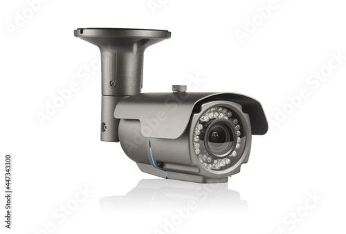 Three-quarter view of square carbon outdoor surveilance camera with led lights on white background with reflection underneath