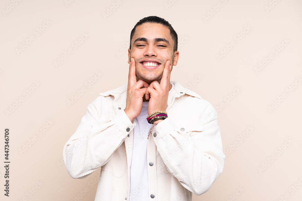 Asian handsome man over isolated background smiling with a happy and pleasant expression Asian handsome man over isolated background smiling with a happy and pleasant expression
