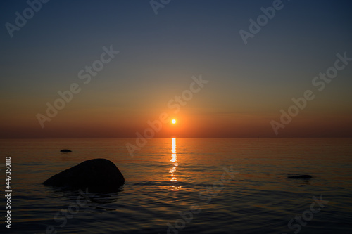 Sunset by the sea. Baltic Sea. Tourism and meditation accompanied by the setting sun.