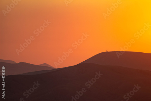 Hills silhouetted on sundown sky. High quality photo