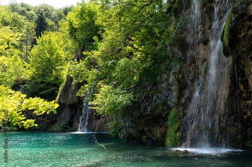 Waterfall with turquoise water in the Plitvice Lakes National Park  Croatia.