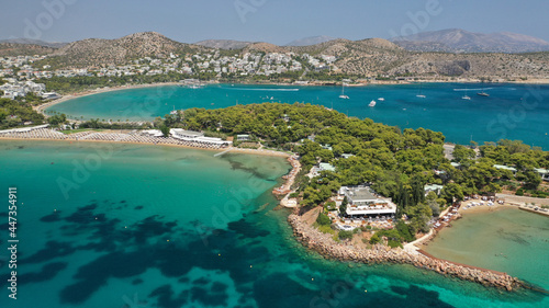 Aerial drone photo of famous celebrity sandy beach of Astir or Asteras in south Athens riviera with turquoise clear sea, Vouliagmeni, Greece © aerial-drone