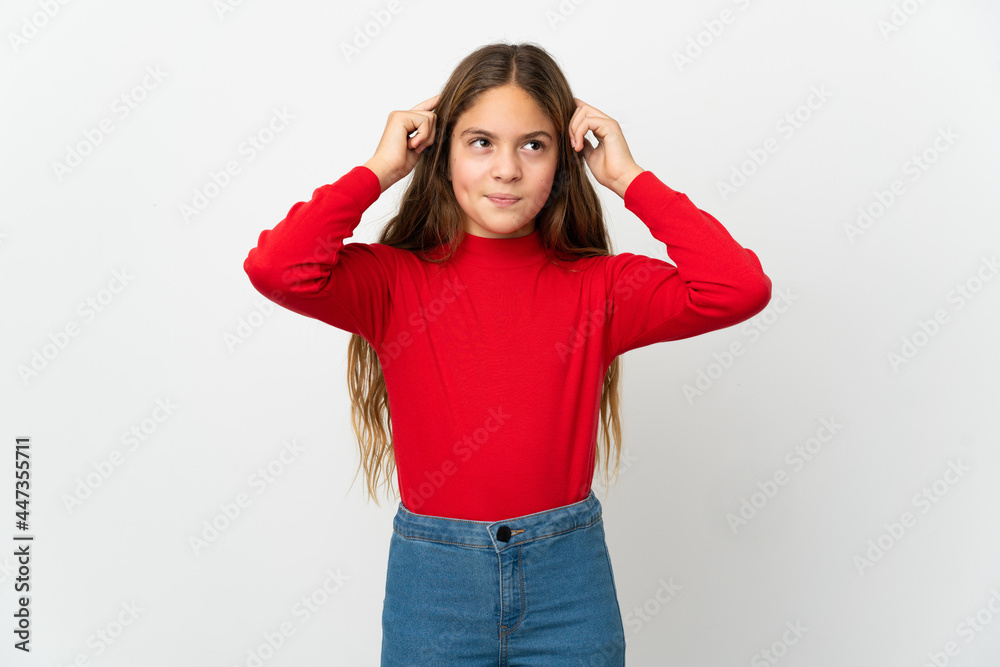 Little girl over isolated white background having doubts and thinking Little girl over isolated white background having doubts and thinking