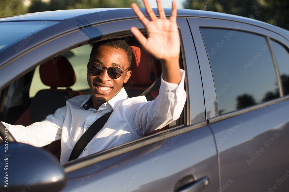 happy african american driving welcomes, in the summer