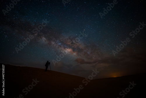 Night landscape with colorful Milky Way in deserts. Starry sky with hills at summer. Beautiful Universe. Space background..