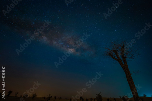 Night landscape with colorful Milky Way in deserts. Starry sky with hills at summer. Beautiful Universe. Space background..