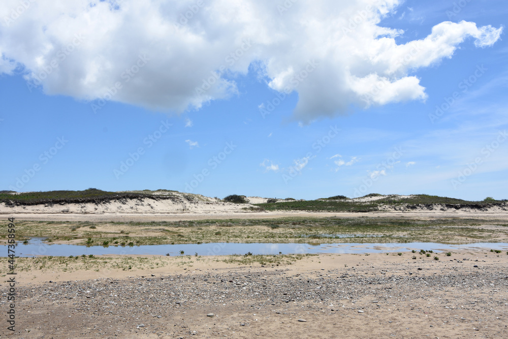 Blue Skies and Fluffy Clouds Over Sand Dunes and Tidal Marsh Blue Skies and Fluffy Clouds Over Sand Dunes and Tidal Marsh