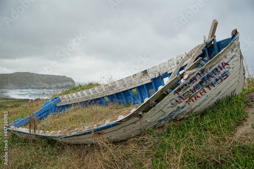 Renaturation. A boatwreck on the beach.